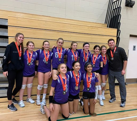 Burlington Defensa girls volleyball athletes winning